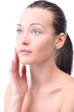 beautiful woman is touching her face, isolated on whiteの写真素材