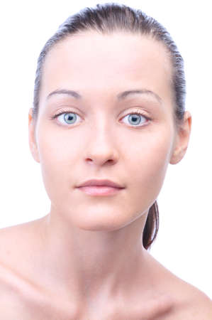portrait of a young beautiful woman looking at camera, isolated on white backgroundの写真素材