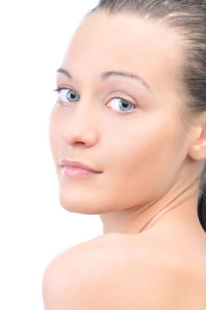 portrait of a young beautiful woman looking at camera, isolated on white backgroundの写真素材