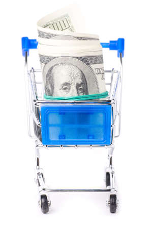dollar notes in shopping cart isolated on whiteの写真素材