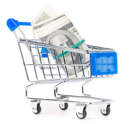 dollar notes in shopping cart isolated on whiteの写真素材
