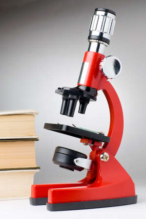 books and microscope, scientific or educational concept の写真素材