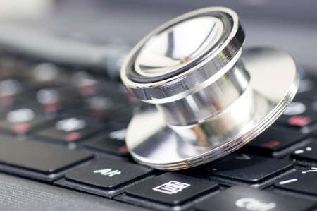 stethoscope on the laptop keyboardの写真素材