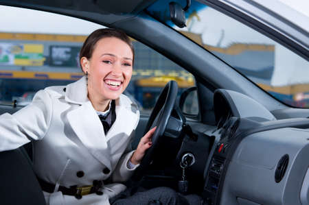 business woman is laughing in her carの写真素材