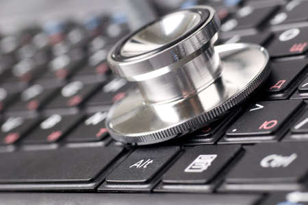 stethoscope on keyboardの写真素材