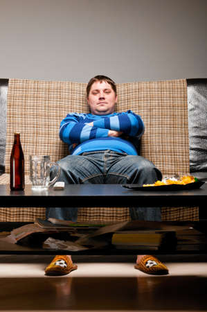 soccer fan on sofaの写真素材