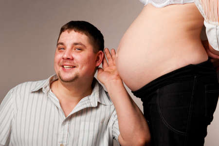 man and pregnant womanの写真素材