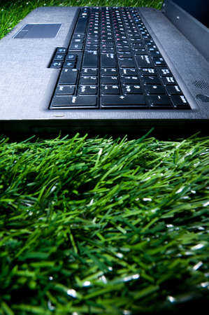laptop in grassの写真素材