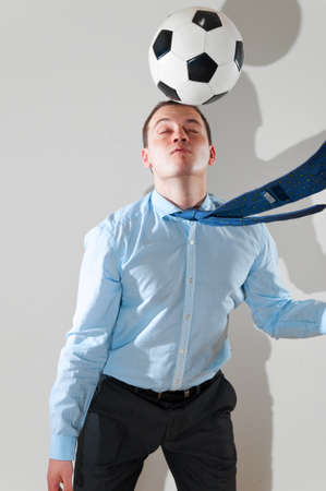 businessman is playing footballの写真素材