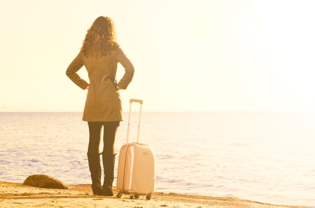 woman at sea in winterの写真素材