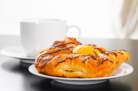 cup of coffee and bunの写真素材