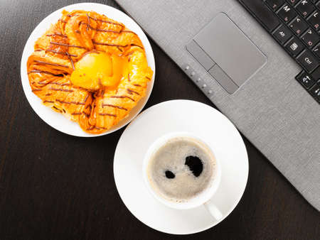 laptop and cup of coffeeの写真素材