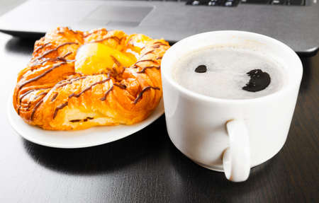 laptop and cup of coffeeの写真素材