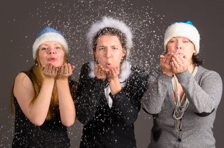 blowing out snow flakes