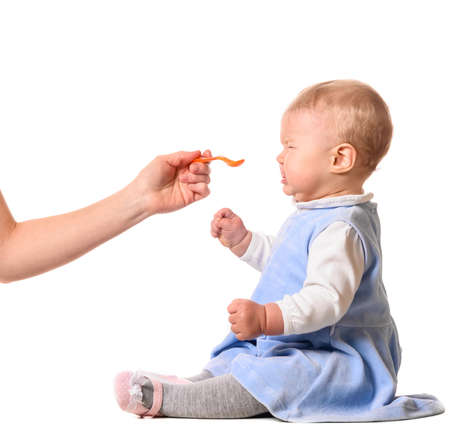 woman is feeding her babyの写真素材