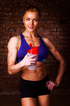 strong woman with sports nutritionの写真素材