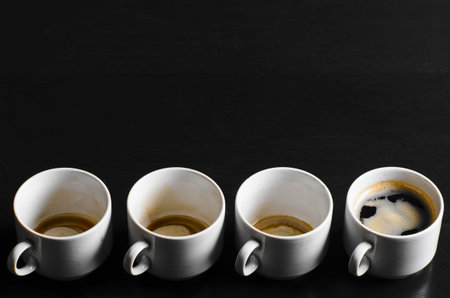 working hours  empty and full cups of fresh espresso, view from above