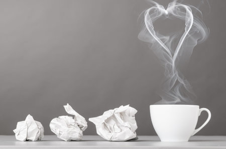 love letter  crumpled wads and heart silhouette on grayの写真素材