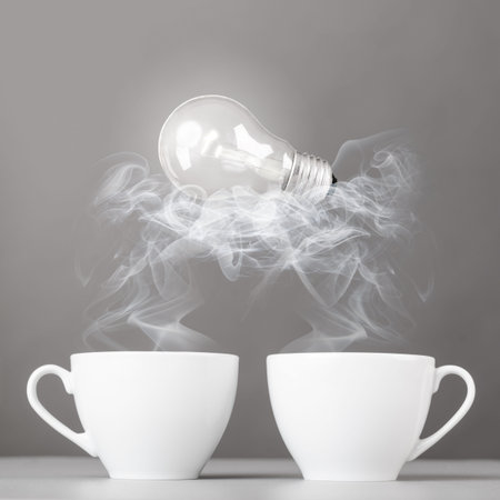 idea birth  bulb is lying on steaming hot coffee cups