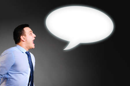 businessman is screaming a blank bannerの写真素材