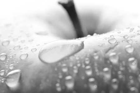 red wet apple with big droplet, macro shotの写真素材