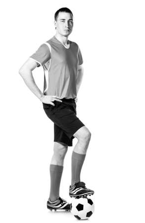 soccer player with ball full length isolated on whiteの写真素材