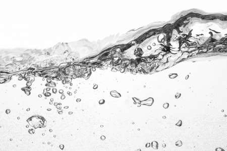closeup of water waves isolated on whiteの写真素材