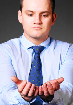 caucasian businessman is holding empty space in handsの写真素材