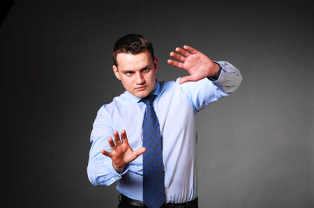 caucasian businessman is touching virtual boardの写真素材