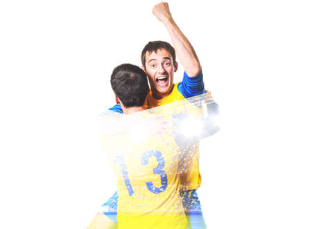 double exposure photo of stadium and soccer or football players celebrating goal with his jersey on headの写真素材