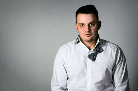 exhausted business man on gray backgroundの写真素材