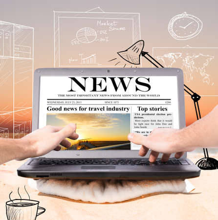 working remotely in virtual office using laptop on beach at sunriseの写真素材