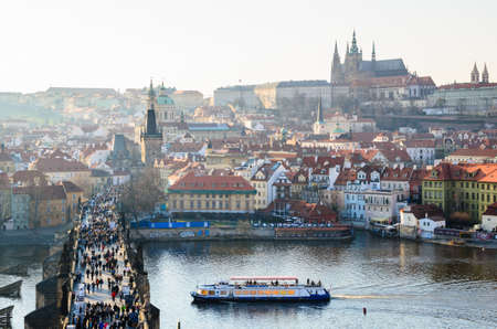 sunset view of Prague castle and Charles bridge over Vltava river, Czech Republicの写真素材