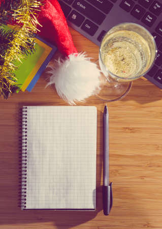 office desk with christmas accessories and stationery, view from aboveの写真素材