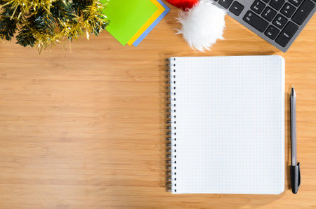 office desk with christmas accessories and stationery, view from aboveの写真素材