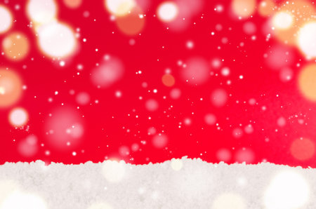 white snow against red decorative christmas backgroundの写真素材