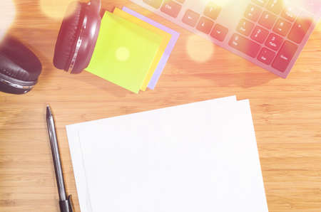 wooden table with office related objects, modern stylish work place, view from aboveの写真素材