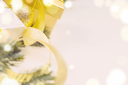 decorative christmas gift boxes and balls on white surface, view from aboveの写真素材