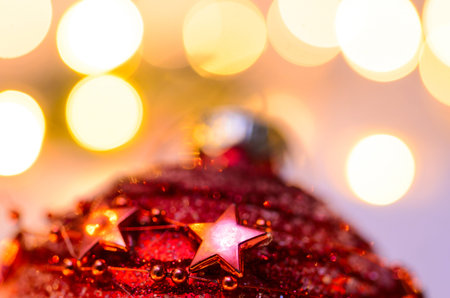 Christmas fir tree with lights and candy cane on snow in dark, view from aboveの写真素材