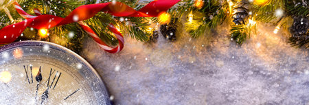 Countdown to midnight. Retro style clock counting last moments before Christmas or New Year 2017 next to decorated fir tree. View from above.の写真素材