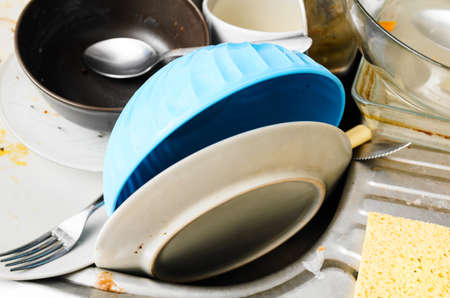 Dirty messy dishes in a sink, view from aboveの写真素材