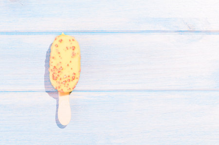 Ice cream on blue table outdoors
