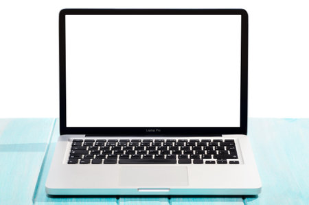Work on the go. Modern laptop computer on blue wooden table against white background