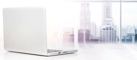Modern laptop computer on white background, rear view