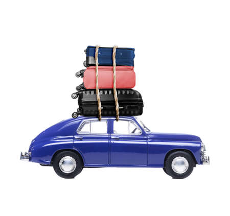 Blue retro toy car with travel cases.の写真素材