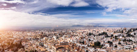 Panoramic view of Granada city against mountains, Andalusia, Spainの写真素材