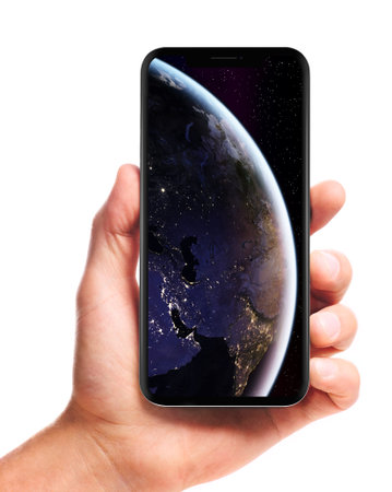 male hand holding bezel-less smartphone with Earth picture on screen, isolated on white background.