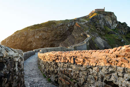 San Juan de Gaztelugatxe , its medieval stairs and bridge at sunset, Basque Country, Spainの写真素材