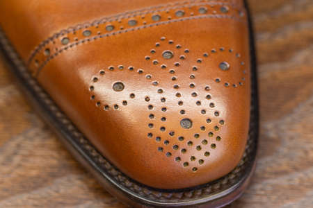 brown brogue toe of men full grain leather shoe, close upの写真素材
