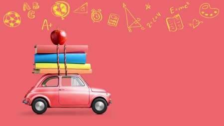 Back to school looped 4k animation. Car delivering books and apple against school blackboard with education symbols.の写真素材